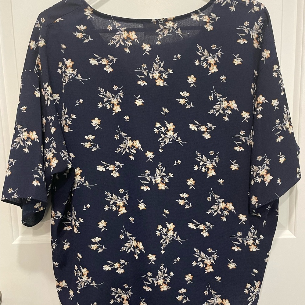 Dark blue w/flower print tie front top